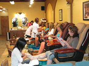 women receiving spa foot pedicure treatment